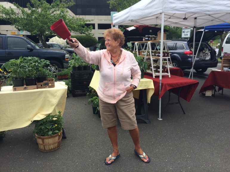 Judy Waldeyer rings the bell to start the Greenwich Farmers Market at 9:30. May 20, 2017 Photo: Edouard Quiroga