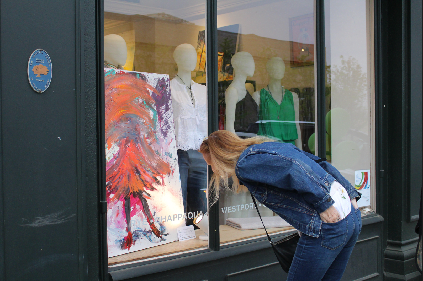 A passerby admires the artwork of Beatrice J Drouhin. May 4, 2017 Photo: Leslie Yager