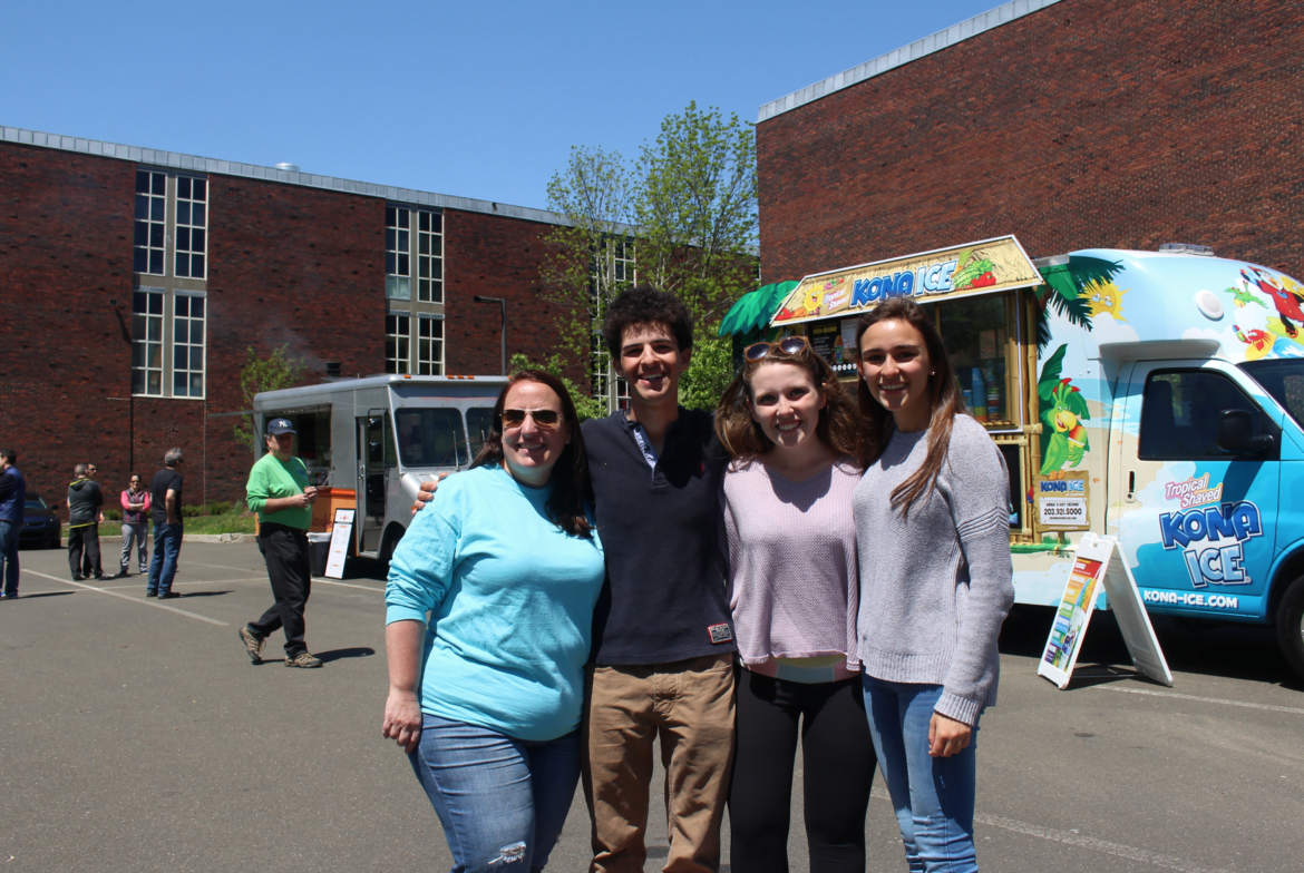 Senior class advisor Jen Lynch, with Jimmy Catalano, Emily Bass and Sophia Vittoria at the food truck fair at Greenwich High School. May 6, 2017 Photo: Leslie Yager