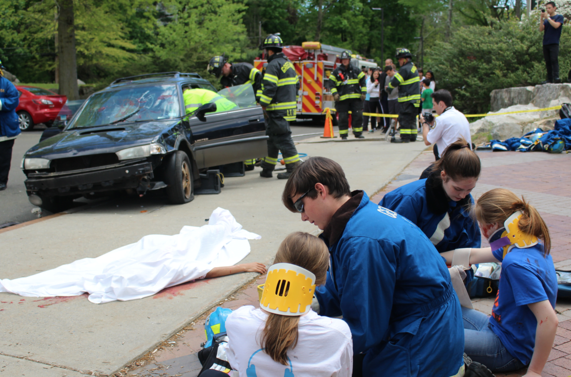 Simulated distracted driving car crash with fatalities at Greenwich High School for Safe Driving Day included participation from Greenwich Police, Greenwich Fire Dept, Explorer post 911 students and GEMS. May 9, 2017 Photo: Leslie Yager