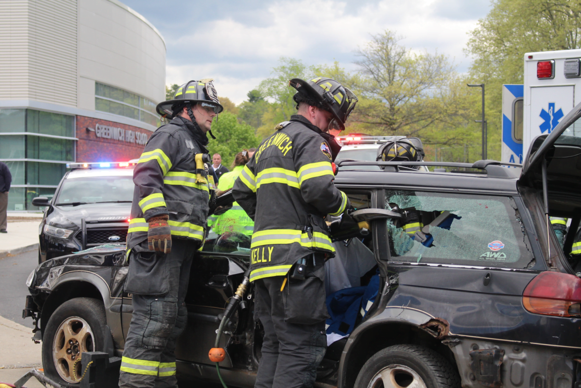 Greenwich Fire Dept members used the Hurst Jaws of Life to cut the posts on the totaled Subaru and remove the roof in order to tend to the injured passengers. May 9, 2017 Photo: Leslie Yager