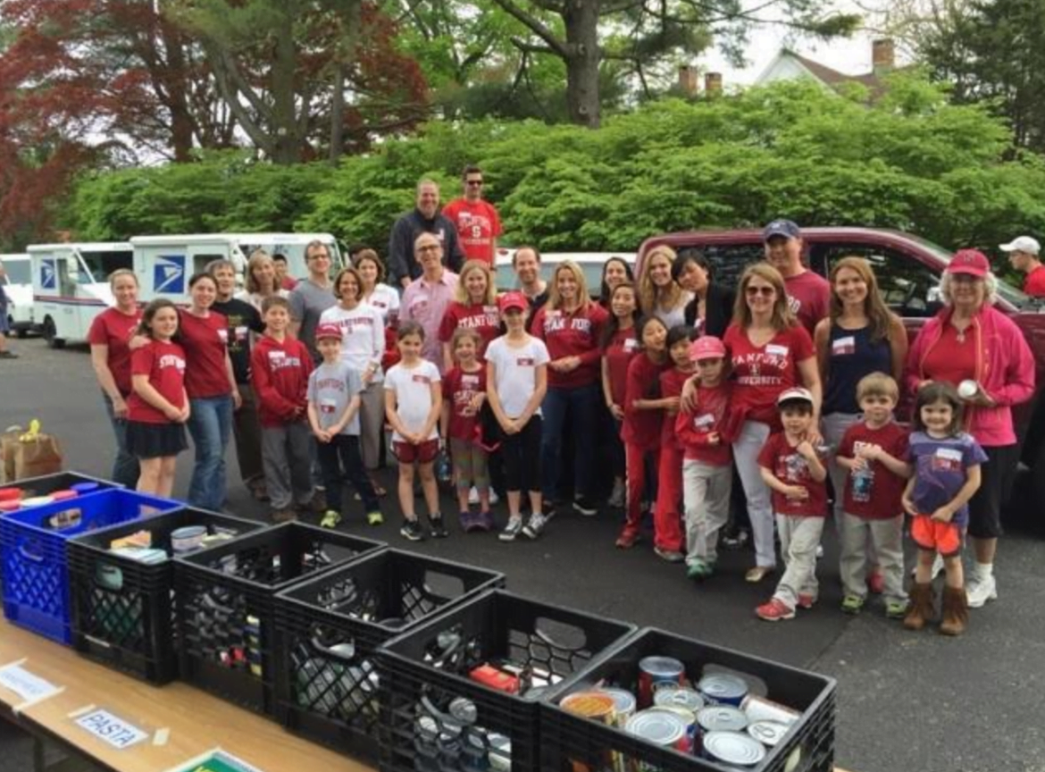 Volunteers from the Stanford University Alumni Club sort donations in 2016.
