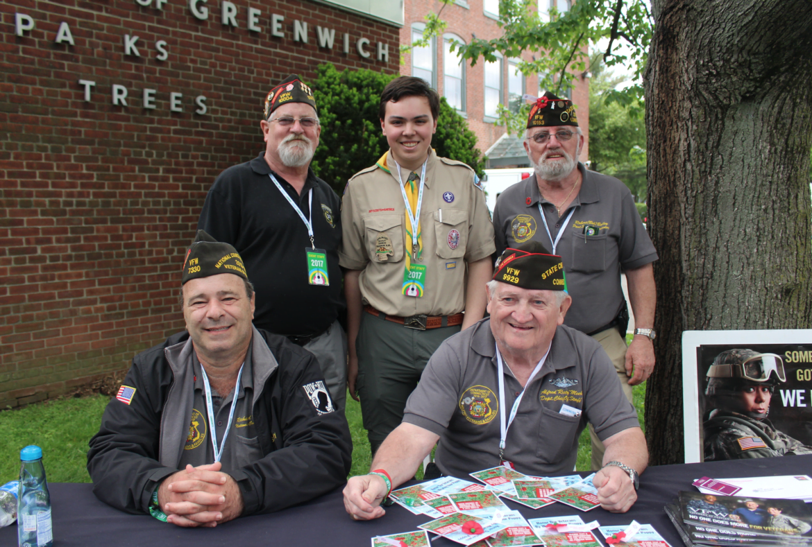 Bennett Hawley with local veterans handing out poppies for Memorial Day at Greenwich Town Party, May 27, 2017 Photo: Leslie Yager
