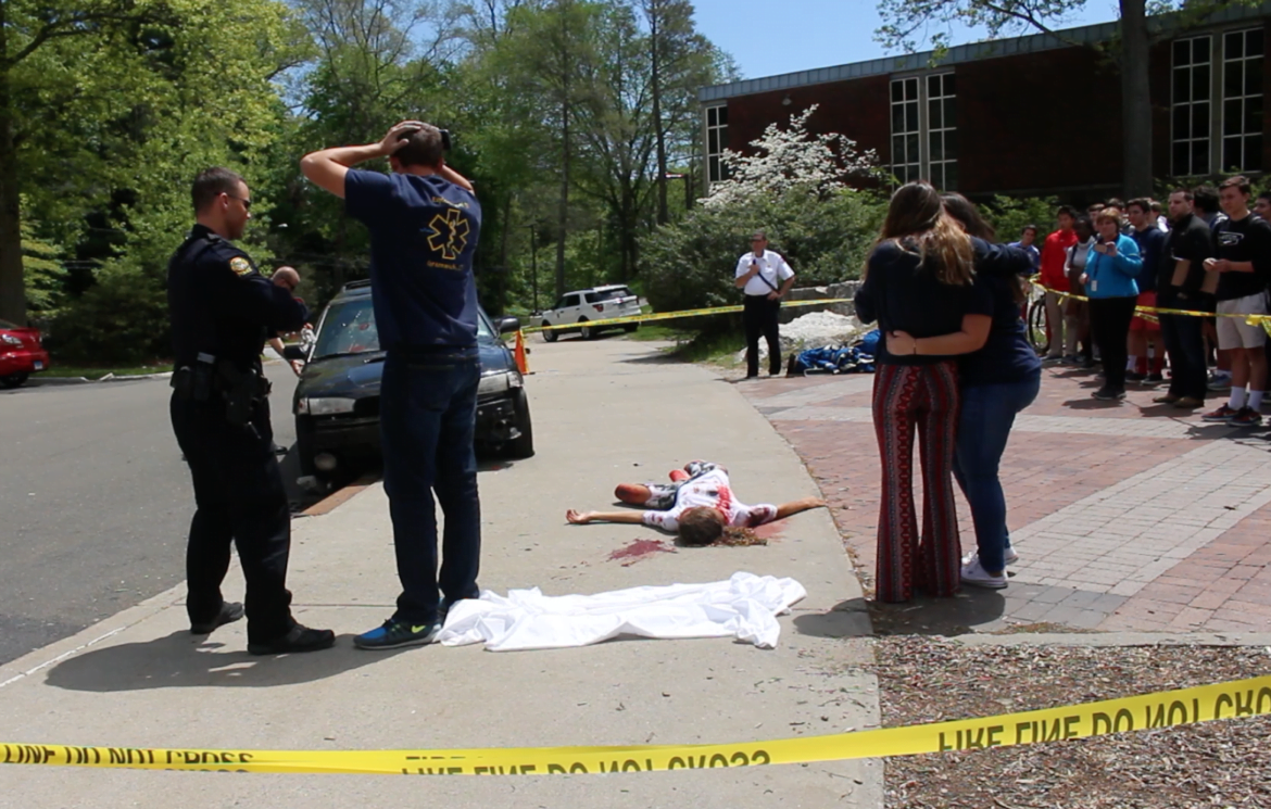 Simulated distracted driving car crash with fatalities at Greenwich High School for safe driving day included participation from Greenwich Police, Greenwich Fire Dept, Explorer post 911 students and GEMS. May 9, 2017 Photo: Leslie Yager