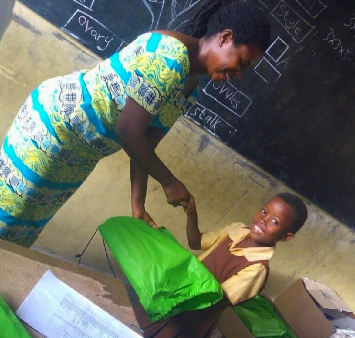 In Ghana s school child with one of the backpacks that was sent from the GHS Education for All Club. Contributed photo