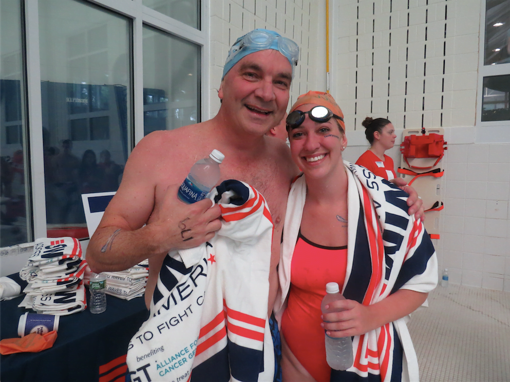 Alec Fraser and Brooke Lorenz finish their swim to honor Julian. Photo: Devon Bedoya.