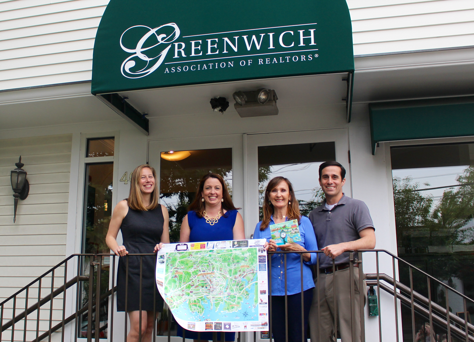 Outside the Greenwich Association of Realtors, Jessica Reid and Craig Jones of Greenwich Point Marketing who collaborated with Liz Norfleet of Norfleet Marketing on a new two-sided illustrated color map of Greenwich. Photo: Leslie Yager