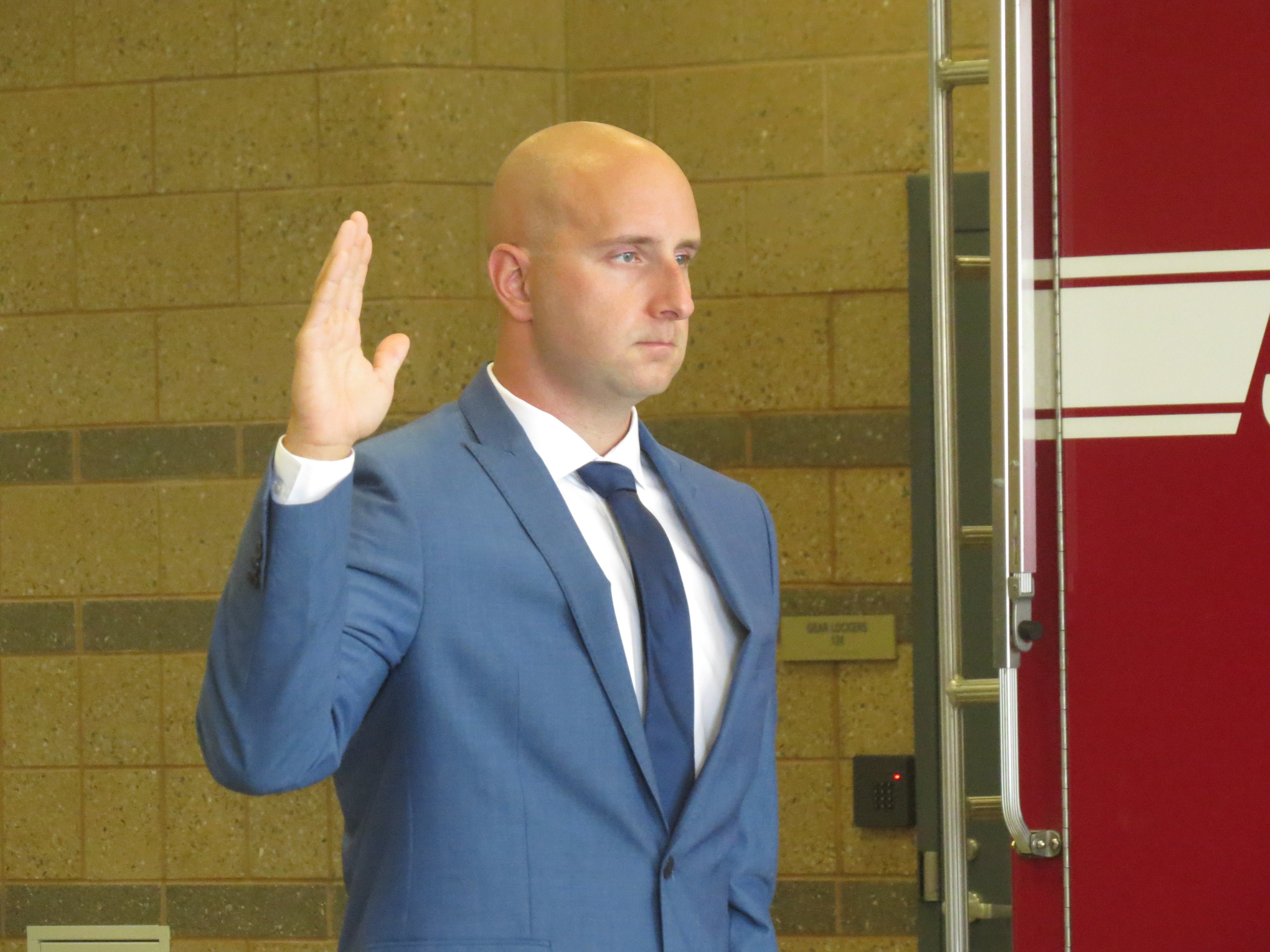 Peter Purcell swears in to be a new member of the Greenwich Fire Department. July 28, 2017. Photo: Devon Bedoya