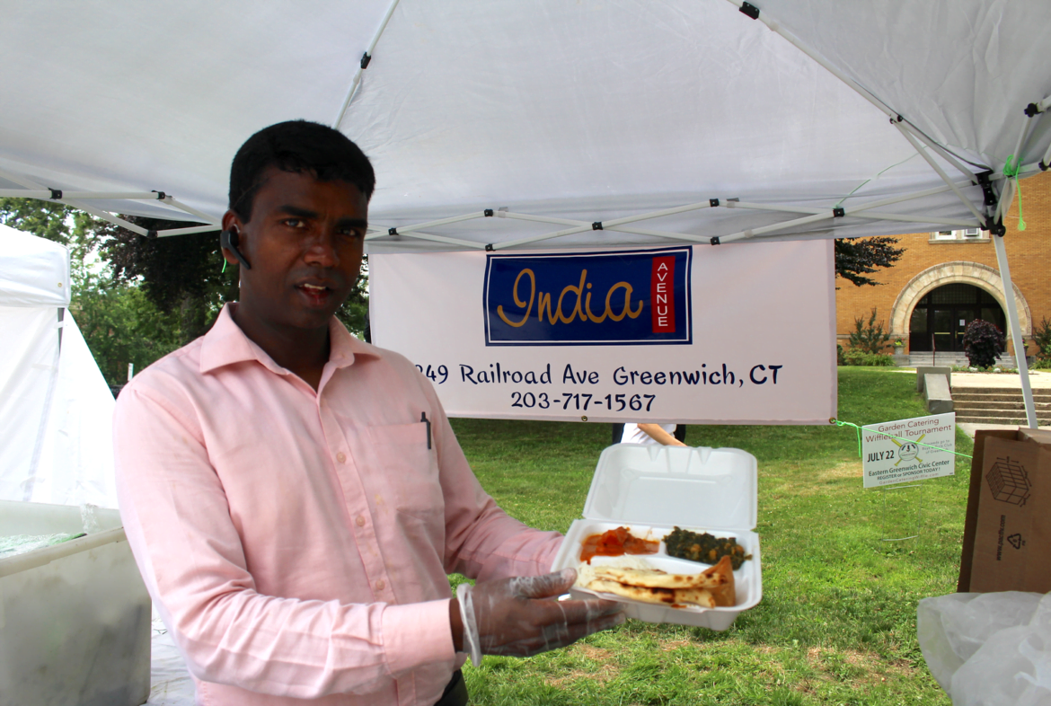 Sampling the delicious food at India Avenue Fine Indian Cuisine in front of the Board of Education building. Credit: Leslie Yager