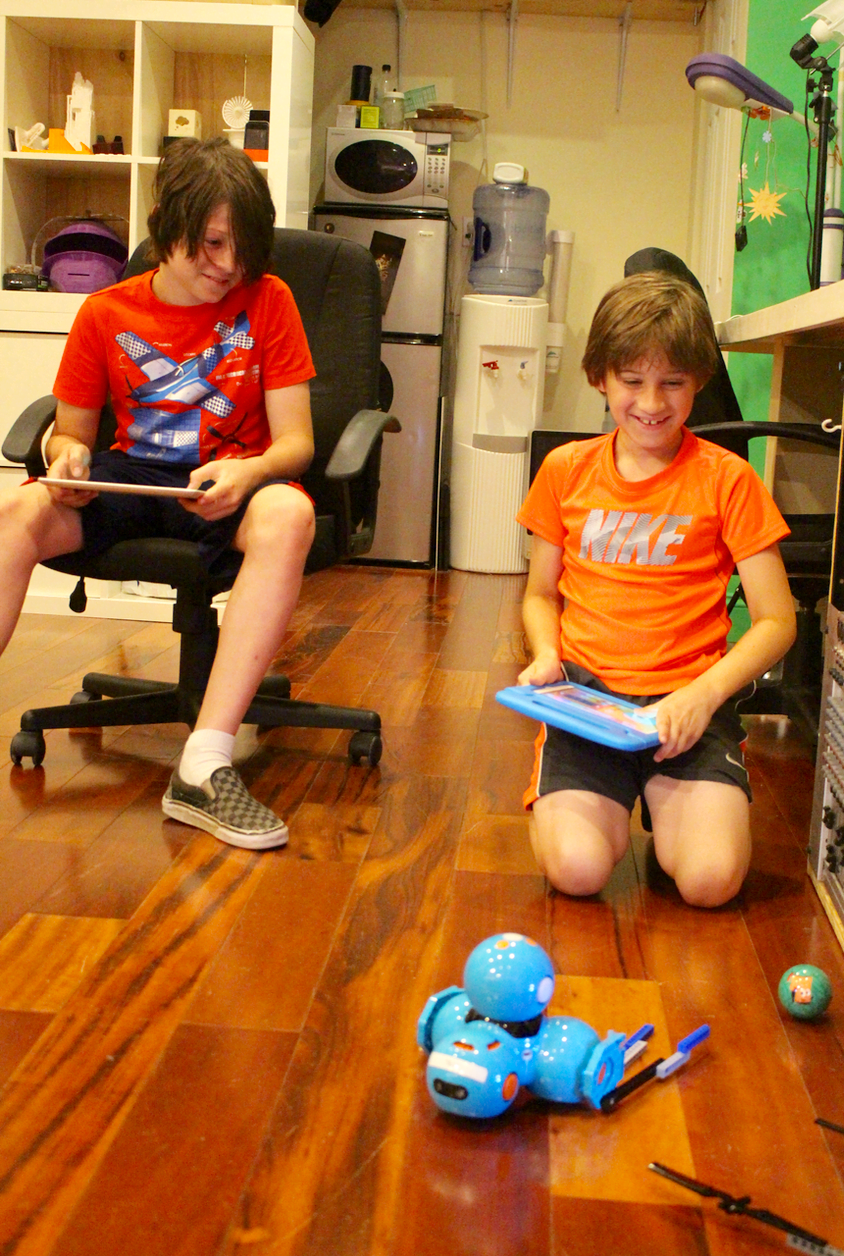  Noah and Ryan use their coding skills to control their robots "Dash" and "Dot" playing soccer at MacInspires July 19, 2017 Photo: Leslie Yager