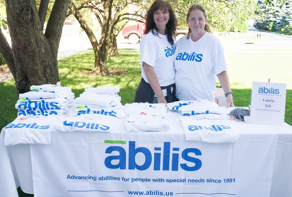 Lisa Sylvester and Kathleen Bonney selling t-shirts to support Abilis during the rally at Greenwich Town Hall on Wednesday, July 26, 2017 Photo Asher Almonacy