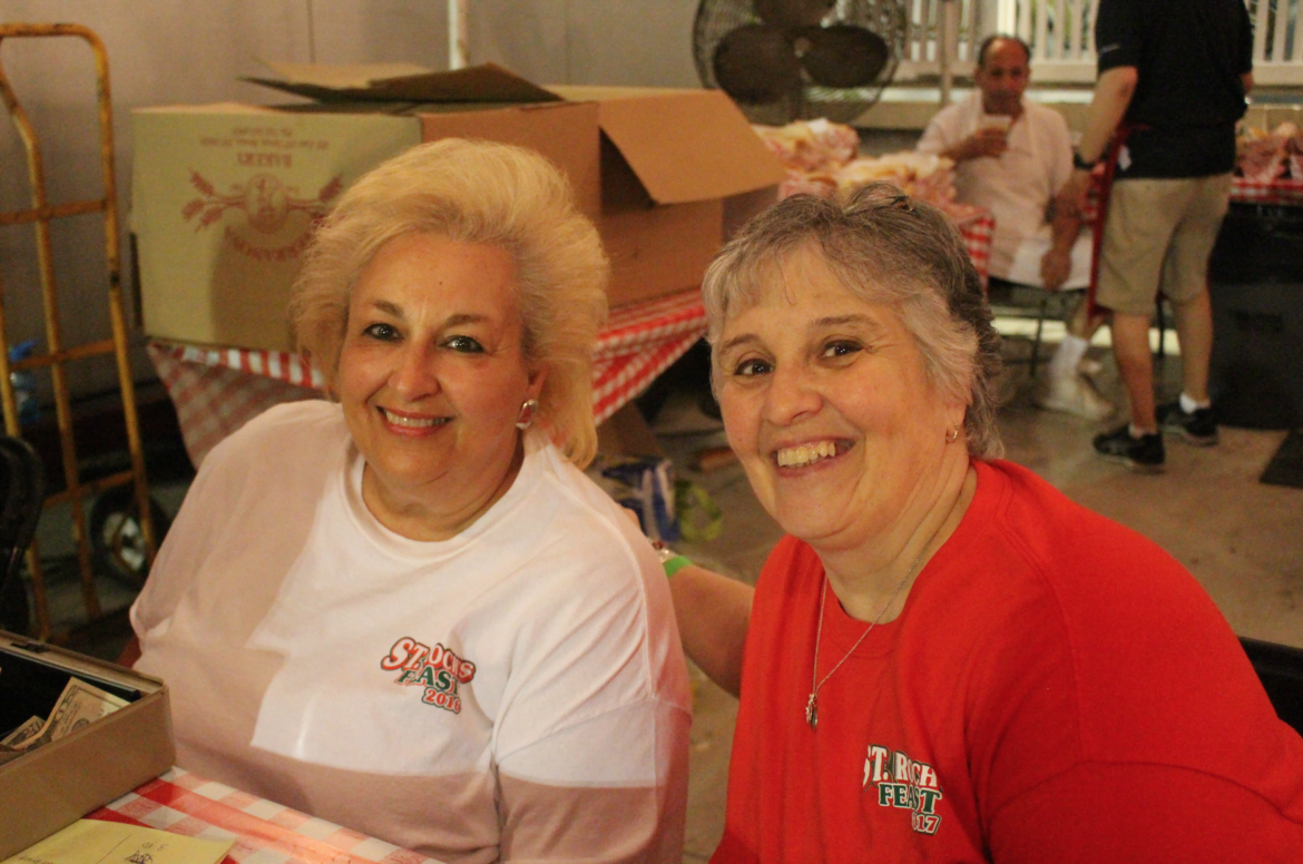 Carmella Budkins and Cathy Derene volunteering at the St. Roch's Feast. Aug 12, 2017 Photo: Leslie Yager