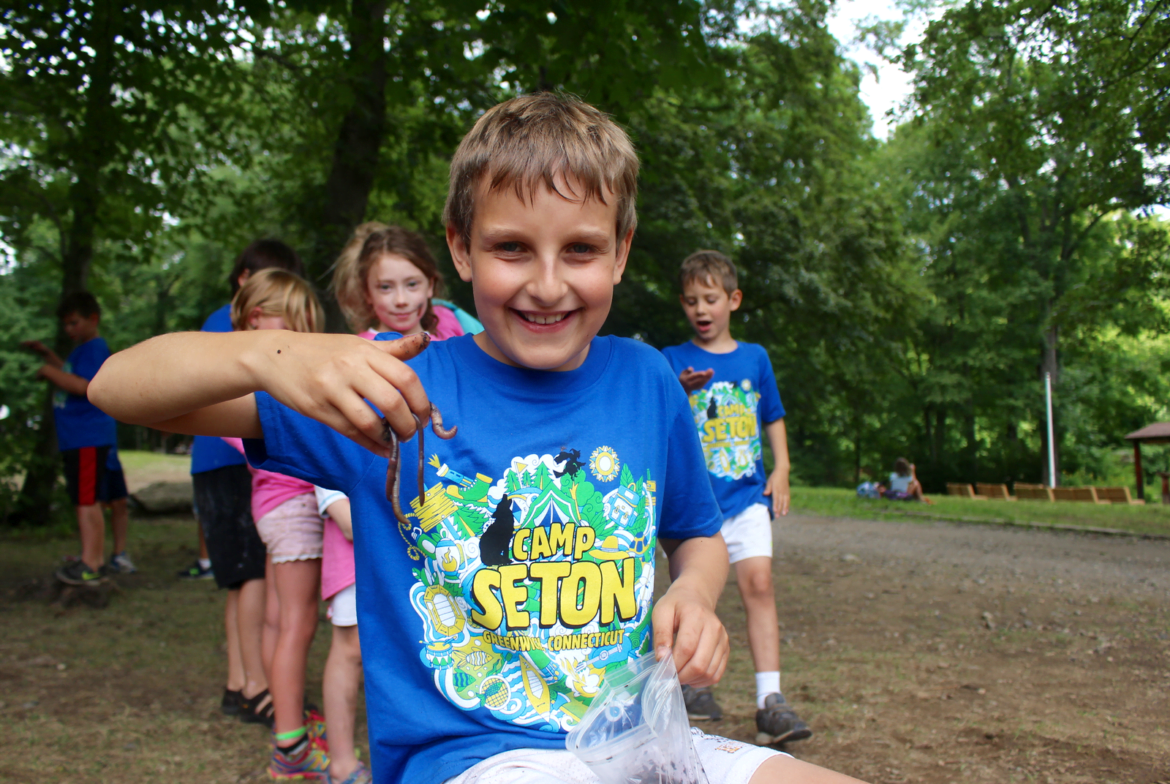 Whit Armstrong shows off one of the worms he collected at Camp Seton. Aug 8, 2017 Photo: Leslie Yager