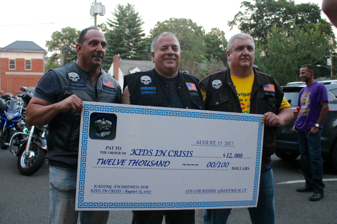 Jimmy Abbate, Rocco Ceci and Teddy Allegrini with a check for $12,000 to donate to Kids in Crisis on Aug 16, 2017 Photo: Leslie Yager