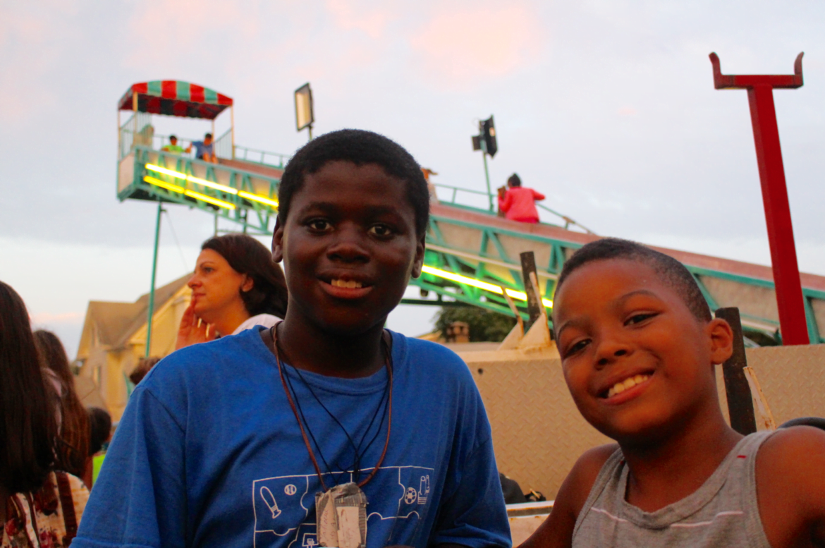 Friends Yahcere and Tyjon waited for a ride on the "salt and pepper" at the St. Roch Festival on Aug 12, 2107 Photo: Leslie Yager