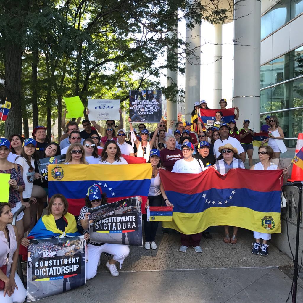 Protesters held the Venezuelan flag and posters posters in front of Government Center in Stamford on July 30. Photo: Rosanna Neri