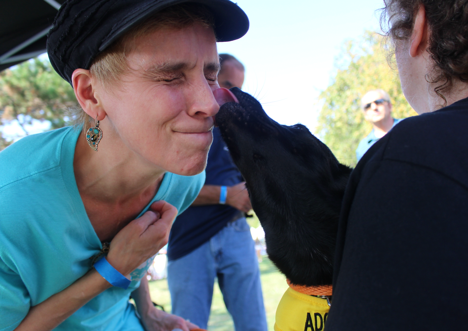 A volunteer with SASS gets a kiss from Spur. Sept 17, 2017 Photo: Leslie Yager