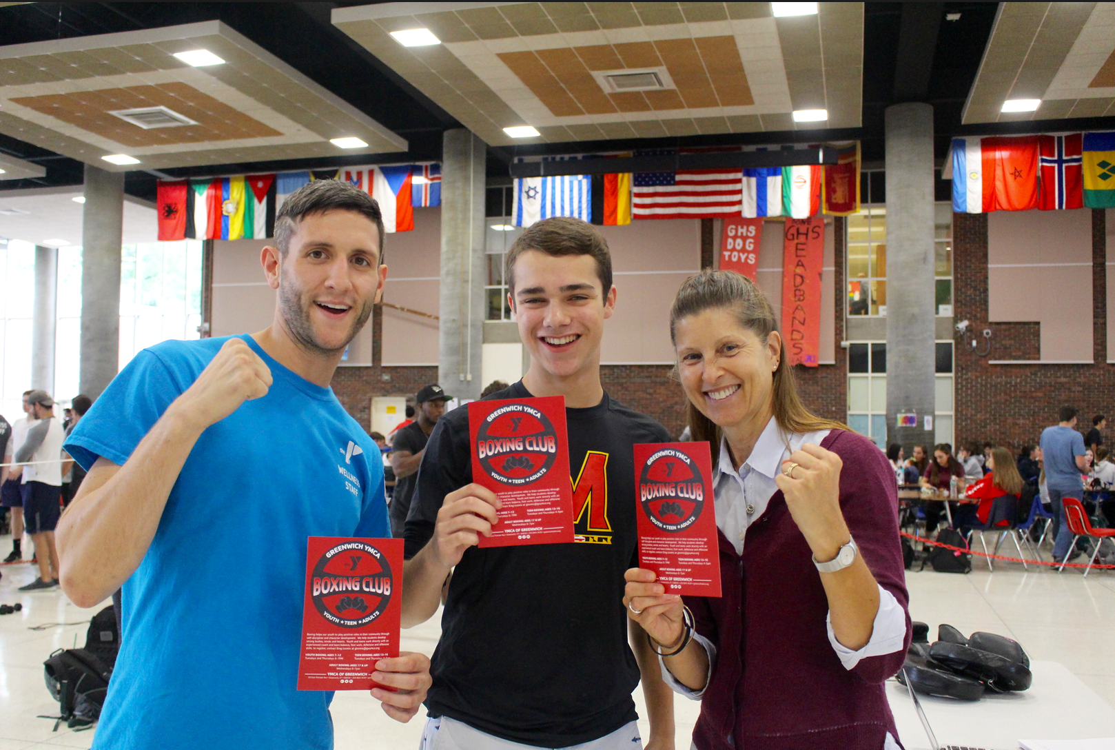 Boxing instructor from YMCA Greenwich Greg Lomis with senior Reese Ochoa and GHS health and wellness teacher Kathy Steiner in the student center on Friday, Sept 29, 2017 Photo: Leslie Yager