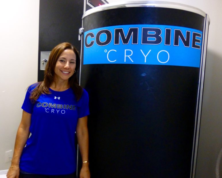 Christina Vitale, co-owner of Combine Training, pictured with the gym's new Cryosauna. Photo: James Finn