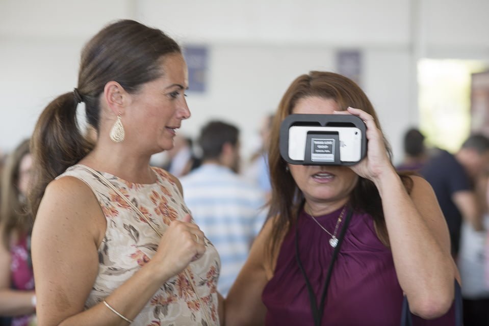 Coldwell Banker's Jen Danzi shared viewing glasses for use with a cell phone and an app with guests of the 2017 Wine + Food Festival, Sept 23, 2017 Photo: Asher Almonacy