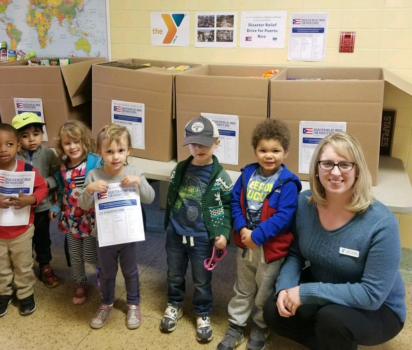 The YMCA of Greenwich Early Learning Center shows the importance of volunteer service and helping others in difficult situations by holding a Puerto Rico Disaster Relief Drive. (L-R) Preschool Teacher Adriana Mendez, Hudson Bressler, Malcom Jean, Nicolas Ribeiro, Lauren Sanders, Gioia Judge, Henry Stuller-Zessman, Martin Berlin, Director of Educational Programs Carly Adames 