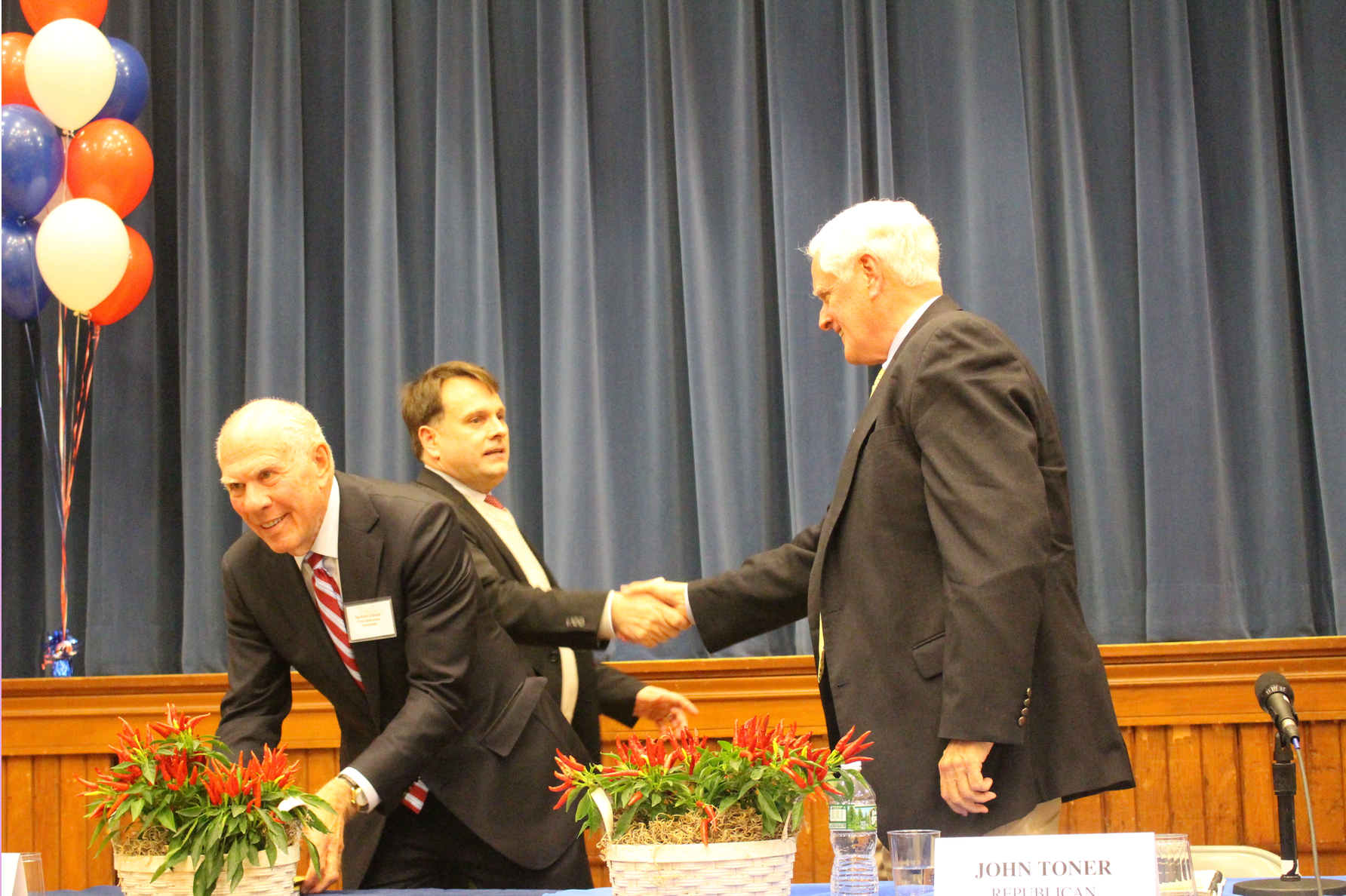 Handshakes at the close of the debate: Drew Marzullo, Sandy Litvack Litvack, John Toner and Peter Tesei. Oct 17, 2017 Photo: Leslie Yager