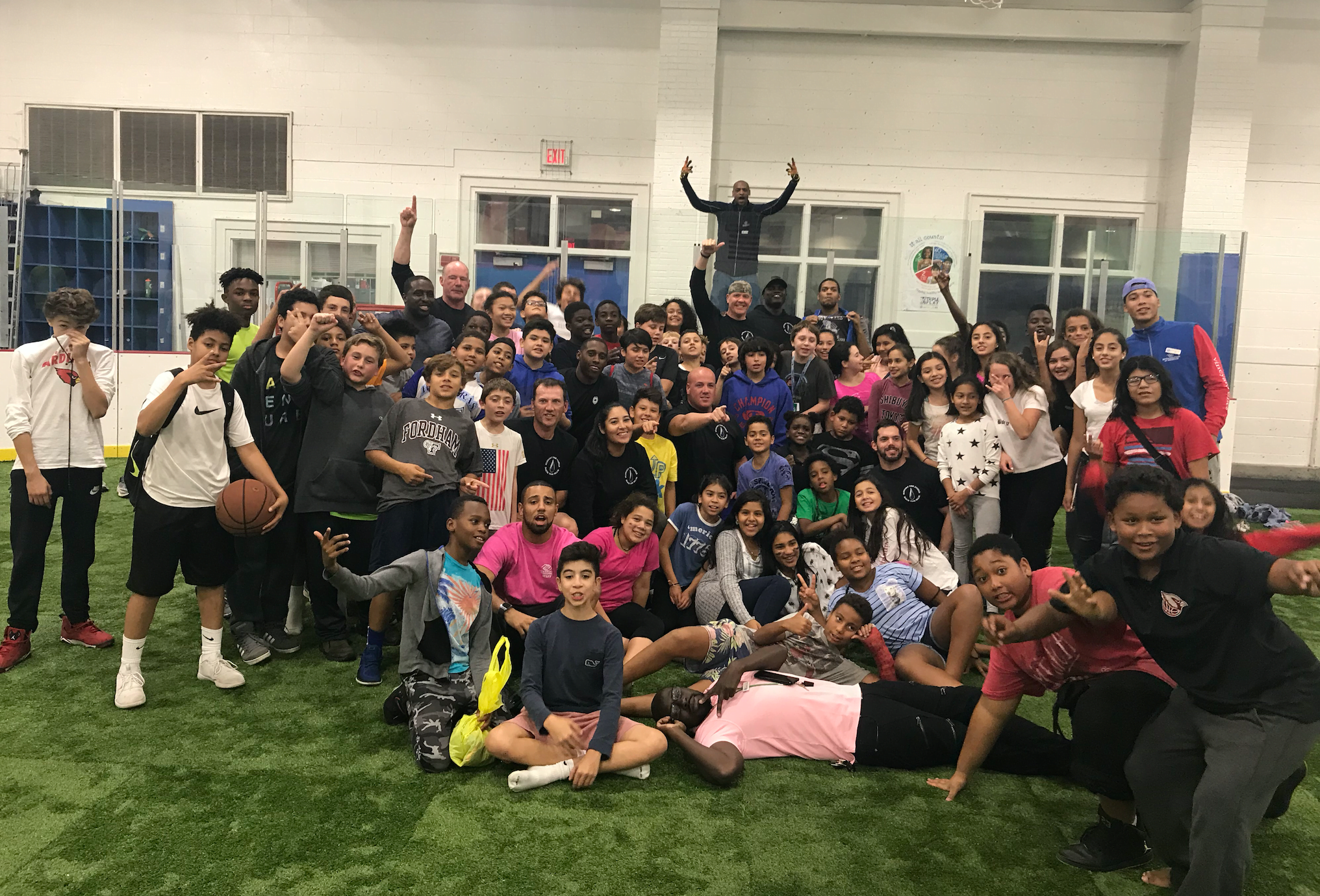 Group photo of middle schoolers from the Boys & Girls Club of Greenwich, with a group of Greenwich Police officers, many who were members of the club when they were younger. Contributed photo