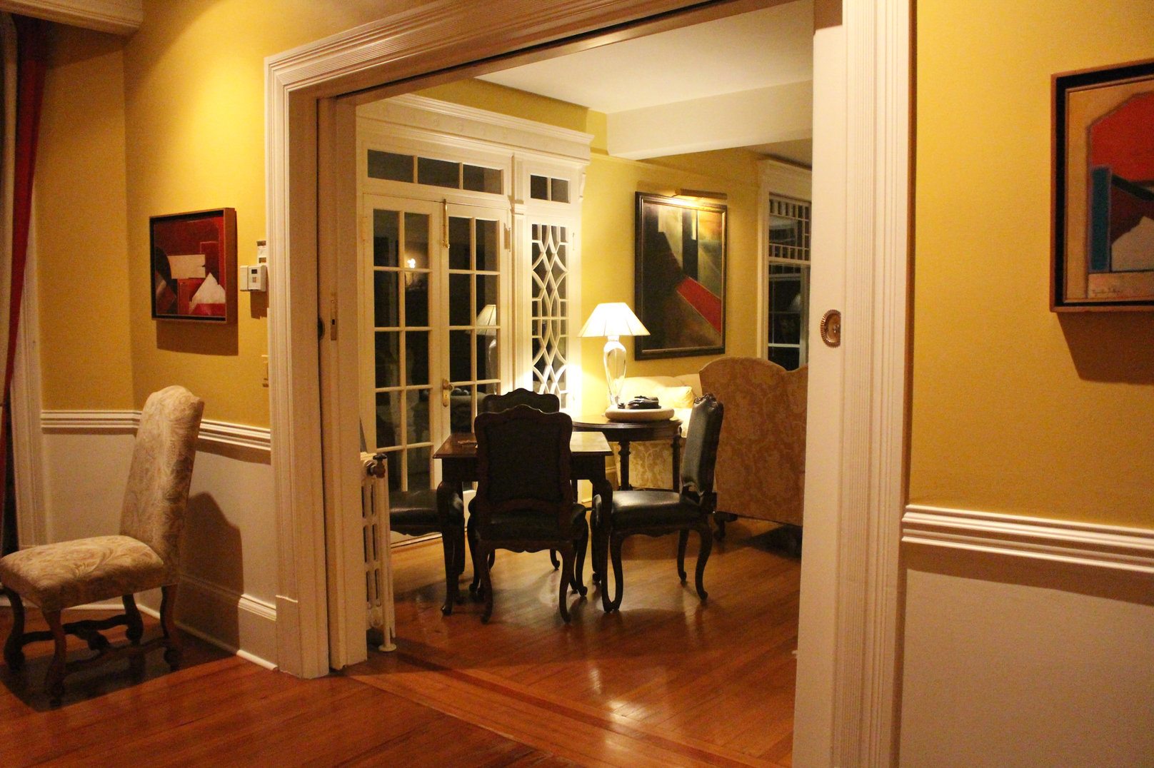 Pocket doors divide living room from dining room in the The John Sparks House. Photo: Leslie Yager