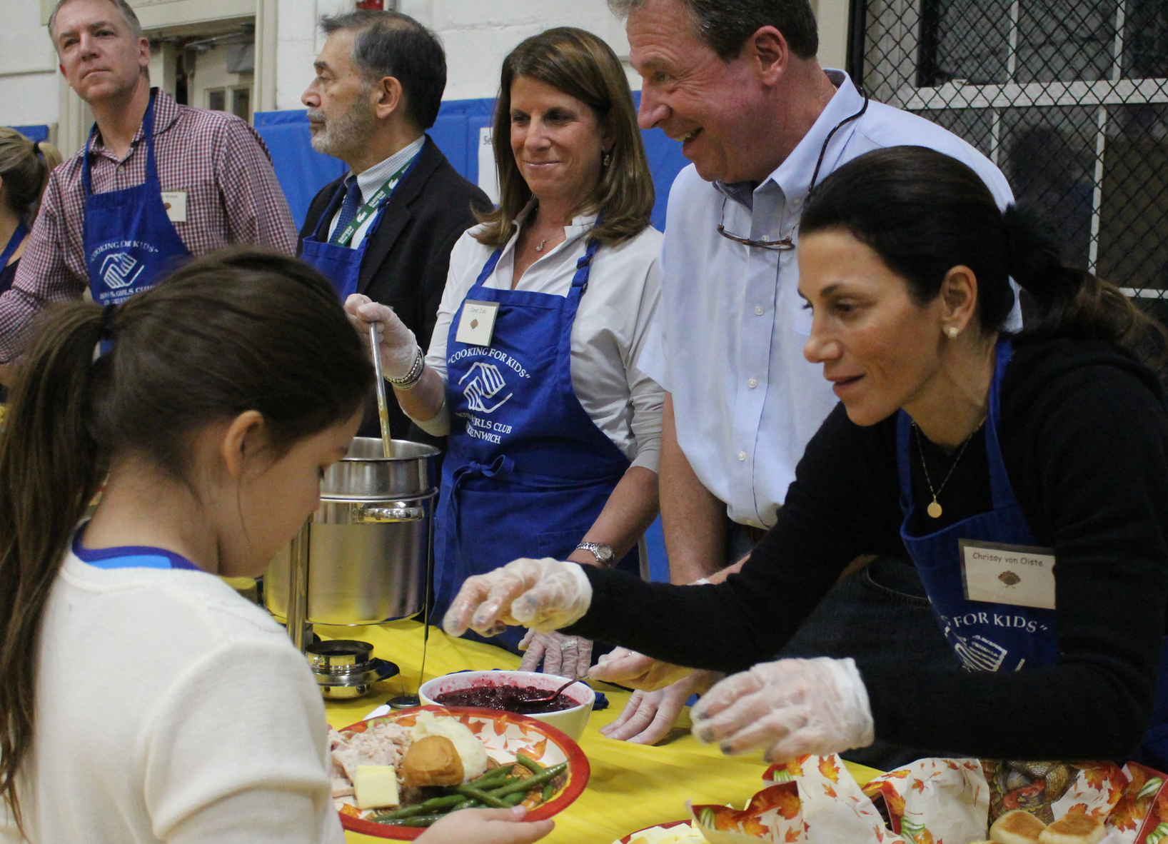 Dozens of volunteers manned the stations at the Boys & Girls Club Thanksgiving feast, Nov. 21, 2017 Photo: Leslie Yager