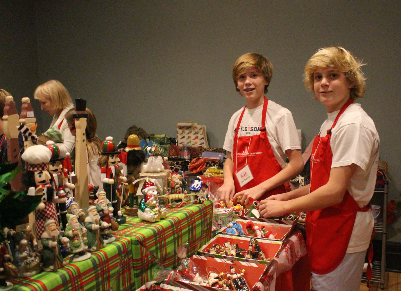 GCDS 7th graders Todd Rosenbaum and Will Duncan were busy in the Children's Giving Shop at the Enchanted Forest. The boys helped children pick out presents. Photo: Leslie Yager
