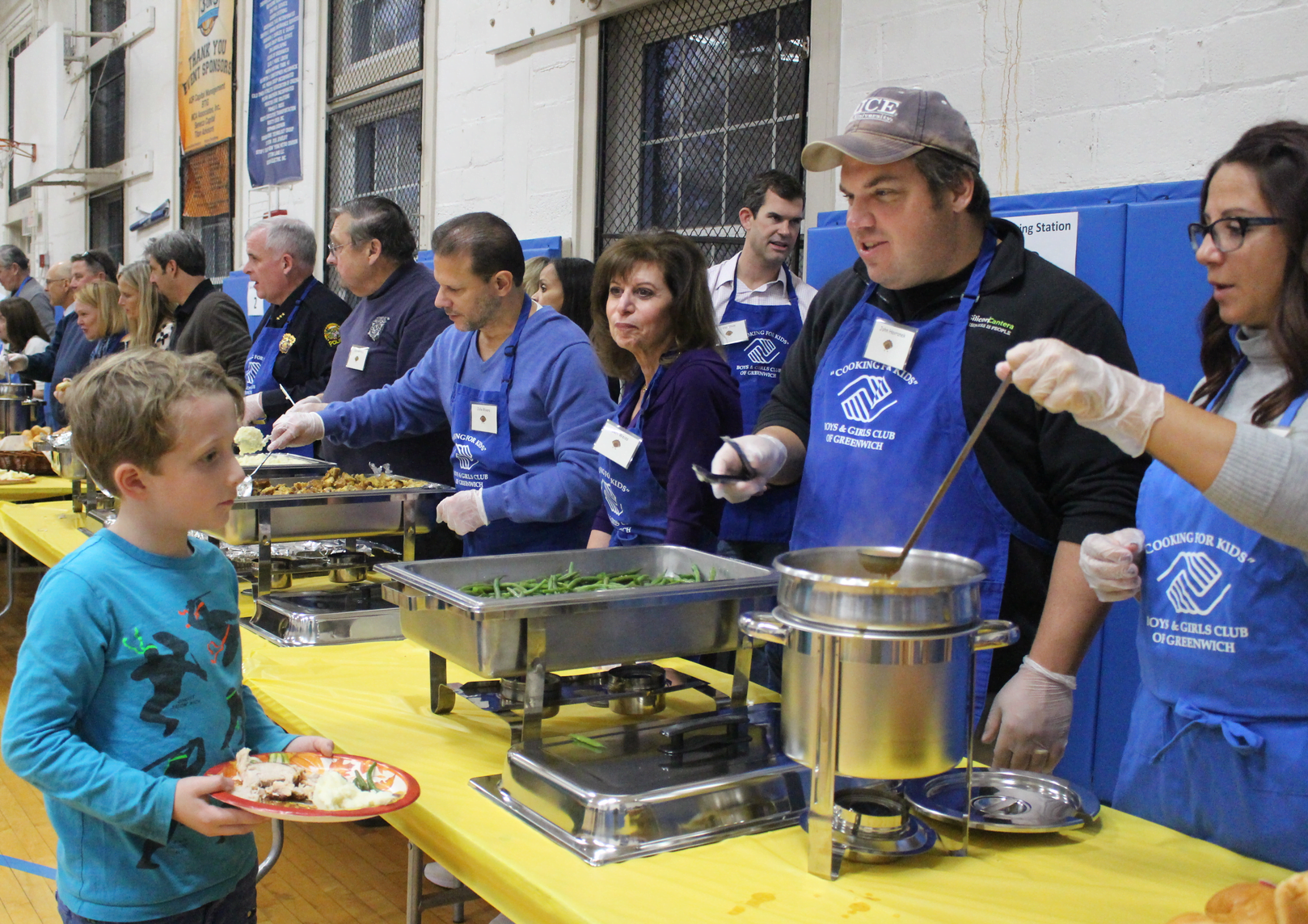 Dozens of volunteers manned the stations at the Boys & Girls Club Thanksgiving dinner, Nov. 21, 2017 Photo: Leslie Yager