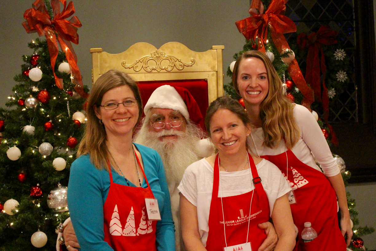 Junior League of Greenwich volunteers with Santa, who will be available for photos with children through Saturday, Nov 18. Photo: Leslie Yager