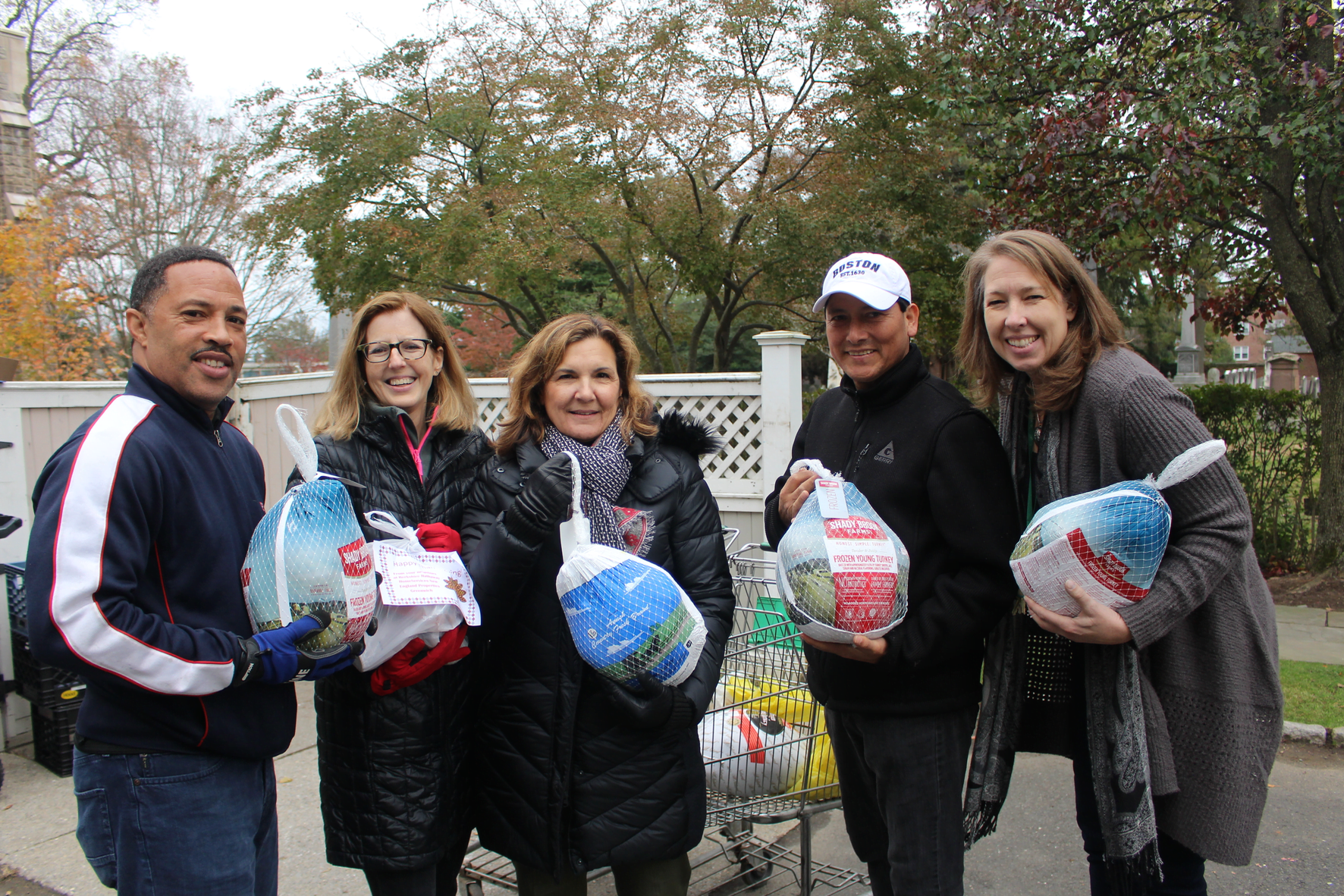 Guy Pettiford, Pam Speer, Anne Pfetsch, and Nancy Coughlin with a client who was happy to receive a turkey from Neighbor to Neighbor on Nov 14, 2017 Photo: Leslie Yager