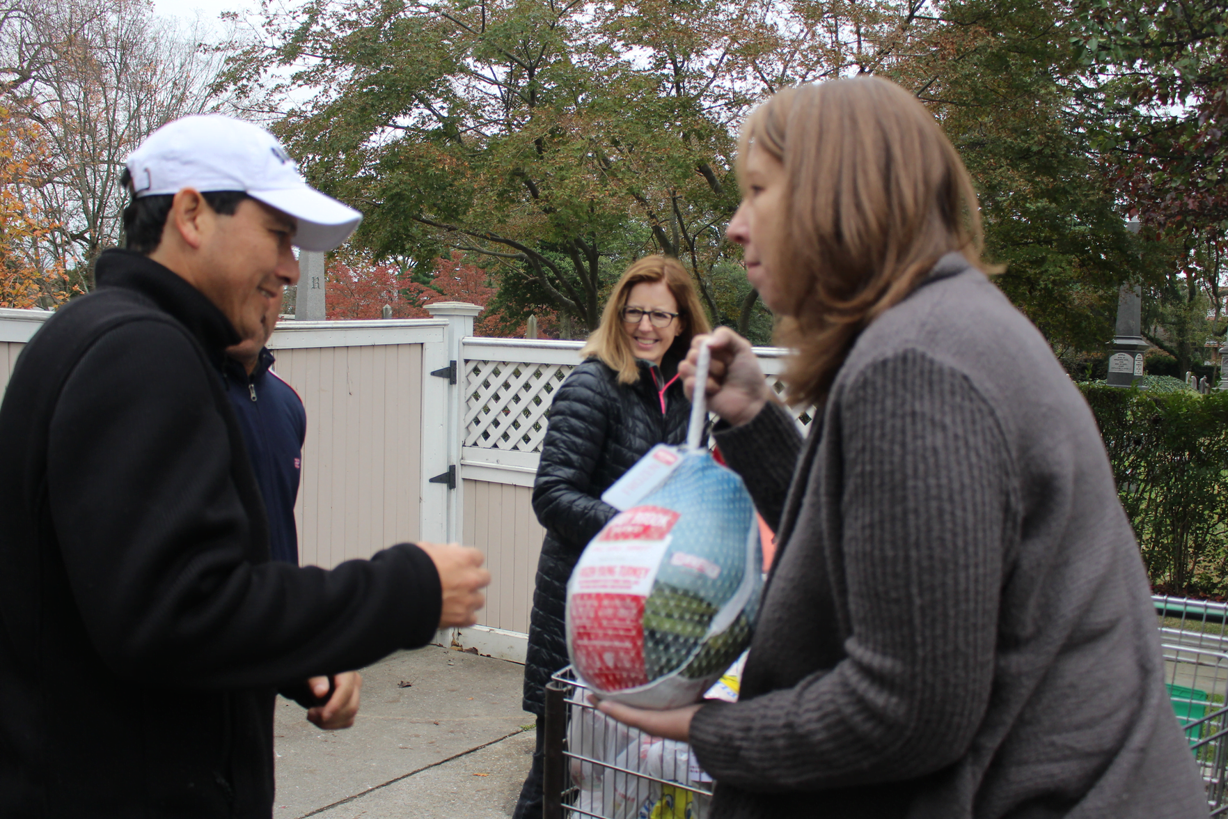 Nancy Coughlin hands out turkeys on Nov 14 at Neighbor to Neighbor. Photo: Leslie Yager