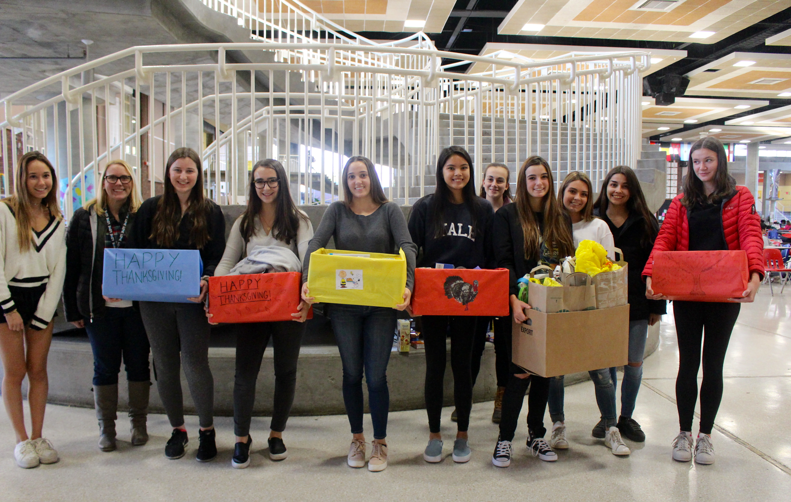 Students of Kathleen Mendez prepared to carry full boxes of Thanksgiving meal fixings from the student center to the south loading dock. Nov 20, 2017 Photo: Leslie Yager