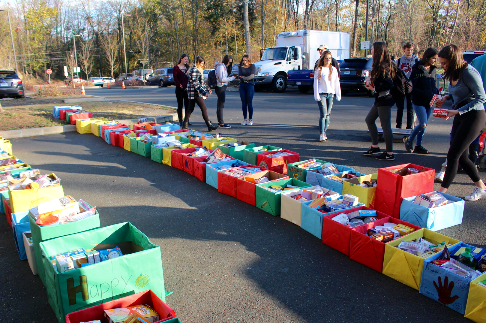 Organizing boxes in the south lot for the Roots & Shoots meal delivery to 150 local families. Nov 20, 2017 Photo: Leslie Yager