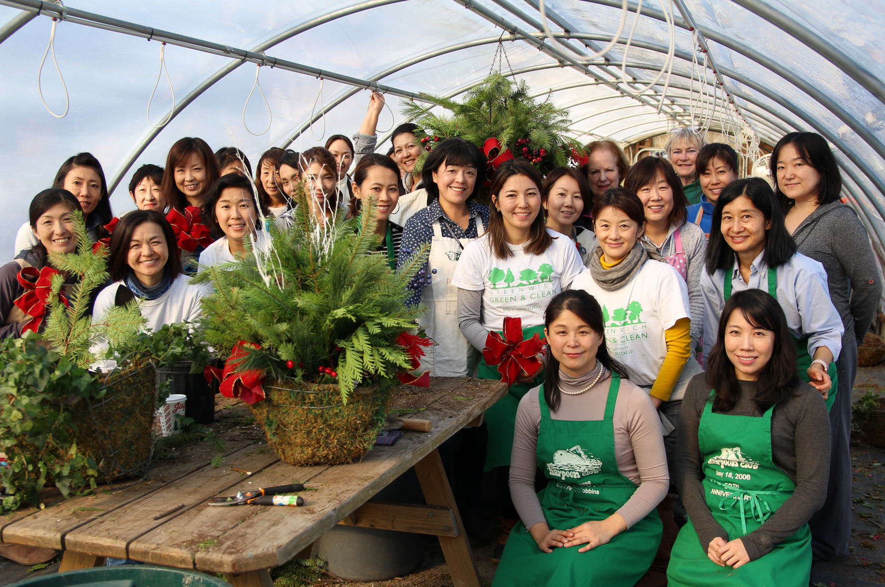 About 30 Japanese women gathered with Mary Hull and Saly Davies at Sam Bridge Nursery & Greenhouses on North Street to arrange holiday baskets of greenery. Photo: Leslie Yager