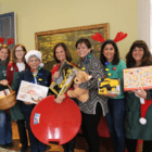 Lori Milton, Pam Speer, Del Sheehan, Sue Golden, MA Moran, Kristen Shapiro, and Cindy Lyall volunteering in the Tomes Higgins House on Friday, Dec 15 for the Neighbor to Neighbor Toy Chest. Photo: Leslie Yager