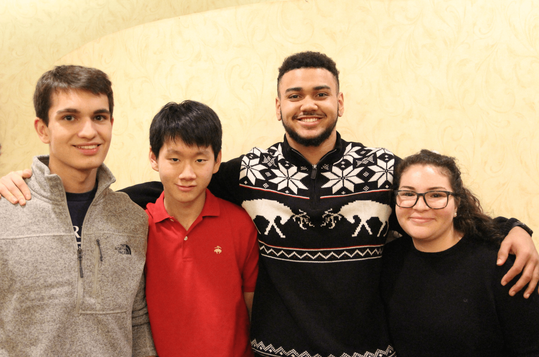 Alex Khan, Woojin Kwak, Sean Deyton, and Katie Pickett all volunteered for the first time at the Knights of Columbus Christmas dinner for seniors. Dec 25, 2017 Photo: Leslie Yager