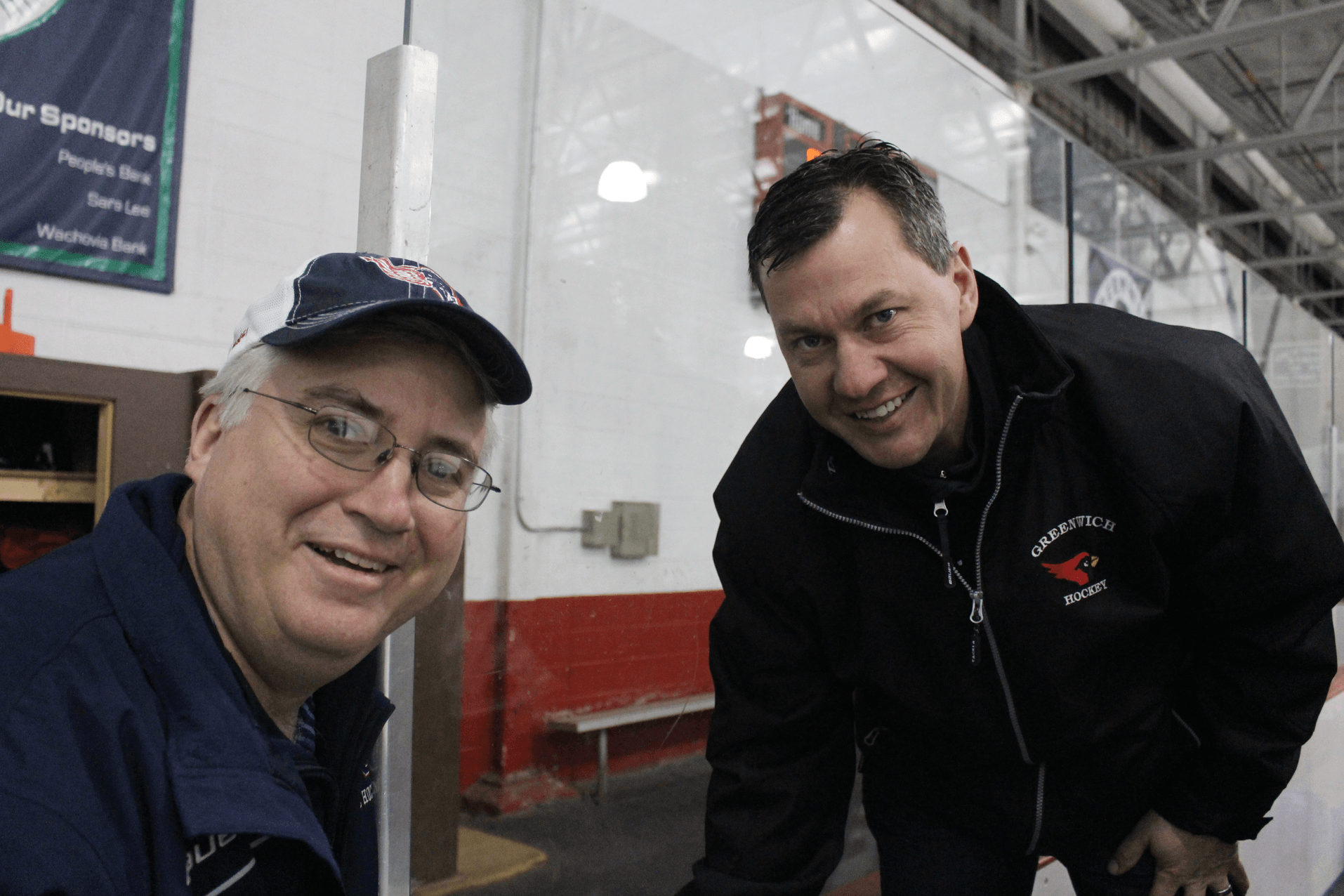 Hockey enthusiast Rich Fulton with GHS Boys Head Coach Chris Rurak at Hamill Rink on March 16, 2017. Photo: Leslie Yager