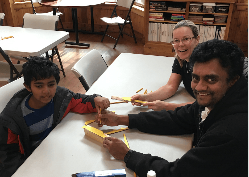 Satya (Pack 23) and his father Rathinasamy Moran with Cubmaster Cindy DiPreta stenciling woodblock prior to attending woodshop at Camp Seton. contributed photo