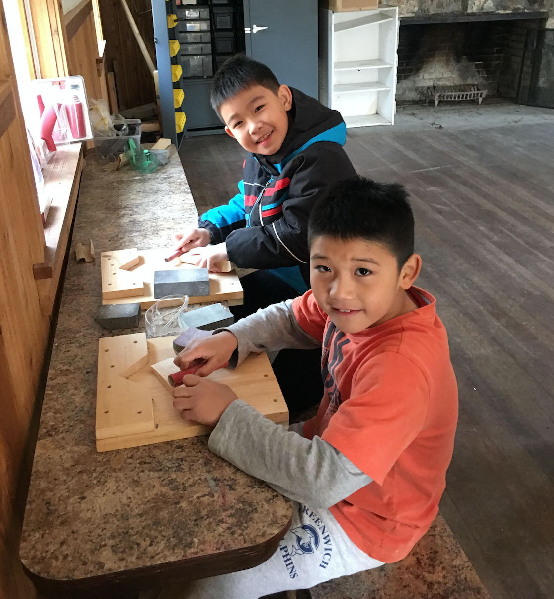 Alexander Yu and George Wang from Pack 23 busy sanding their cars during the recent Pinewood Derby workshop at Camp Seton. contributed photo