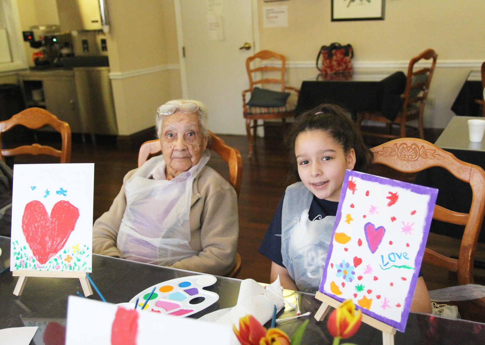 Torch Club members from the Boys & Girls Club of Greenwich paired off with seniors at Parsonage Cottage for a Valentine's Day themed painting project. Feb 17, 2018 Photo: Leslie Yager
