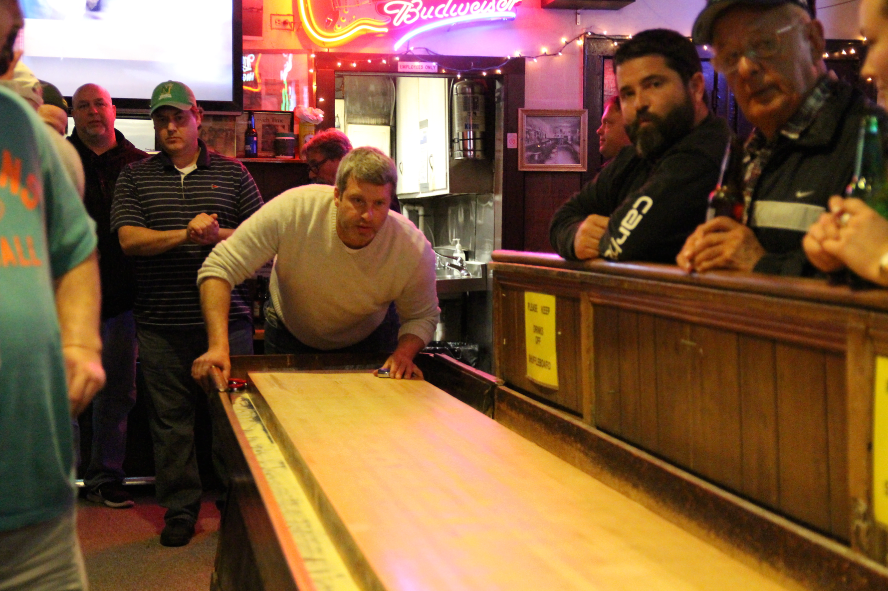 Brian Lowthert playing in the shuffleboard tournament at Bruce Park Grill on Feb 25, 2018 Photo: Leslie Yager
