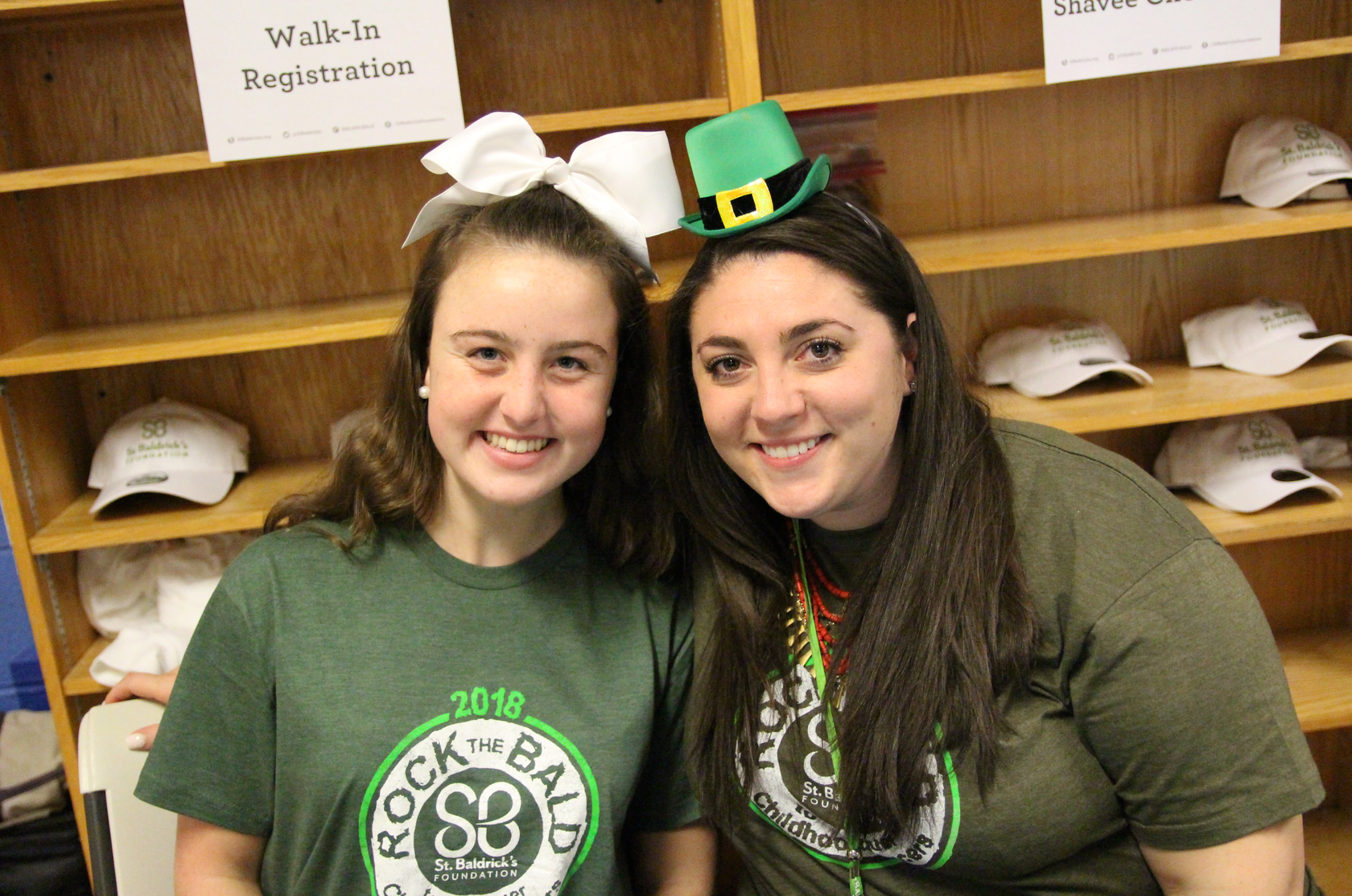 Erica Smith and Erin Montague at the St. Baldrick's head shaving event at Western Middle School. March 15, 2018 Photo: Leslie Yager