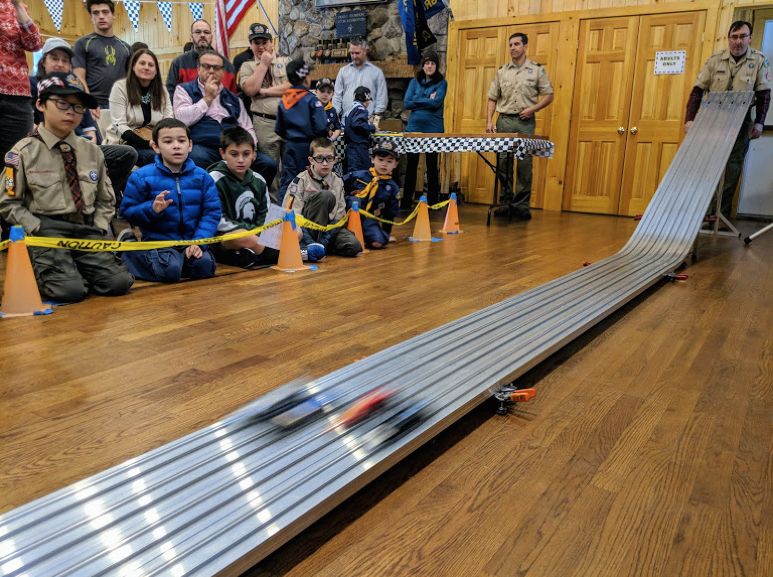 Cub Scouts watch their cars race down the track at the Pinewood Derby Championship at Seton Scout Reservation in Greenwich. Photo Credit: Marc Ducret