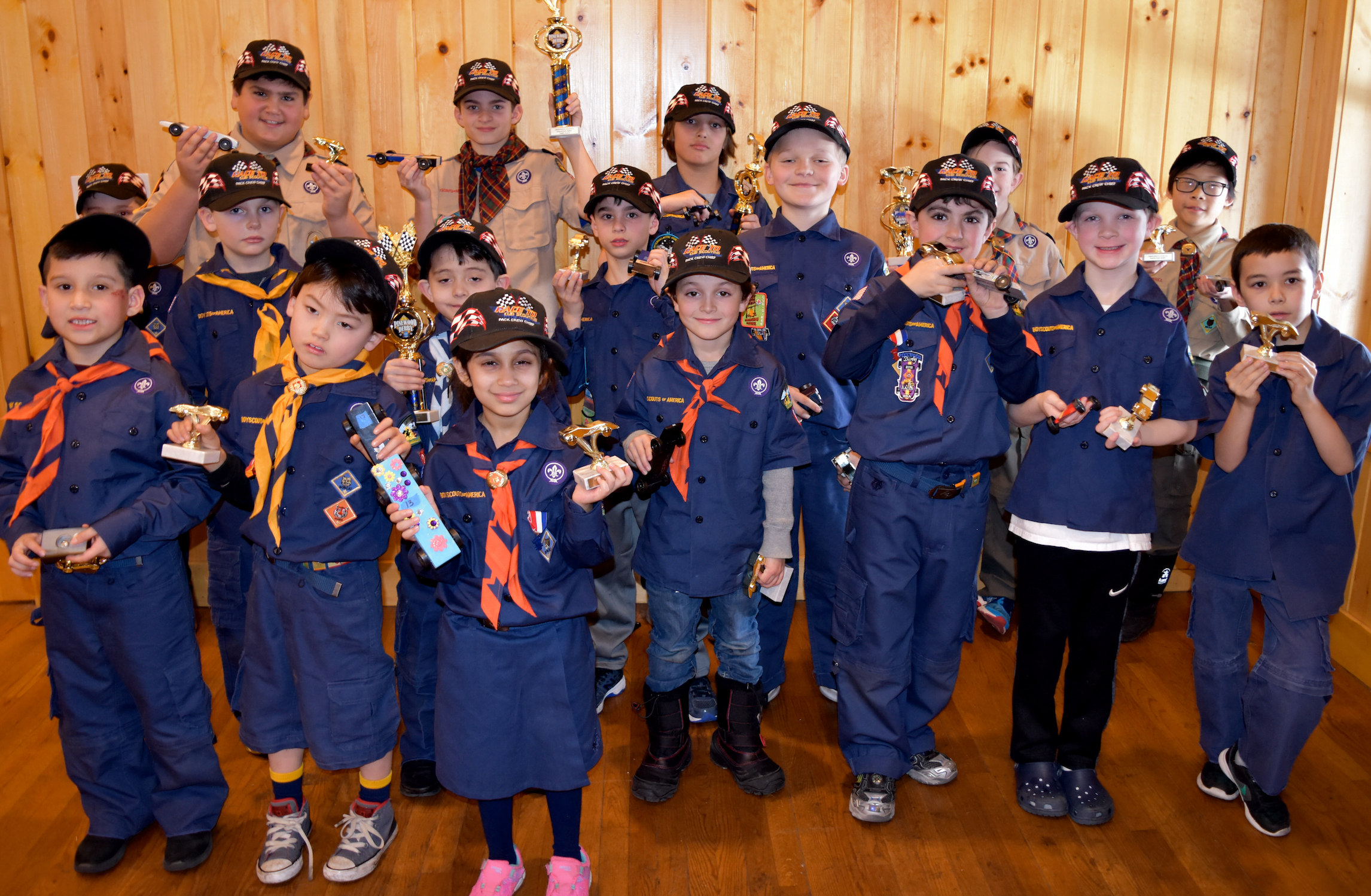 Vanya Kapur, the first girl eligible and to quality to race in a Greenwich Council Pinewood Derby Championship, with fellow Cub Scouts at Seton Scout Reservation. Photo credit: Ray Garrison