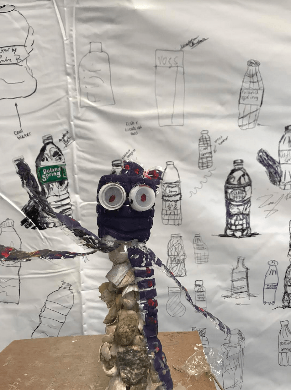 EMS Students Create "Message in a Bottle" Art Installation with Reclaimed Materials 