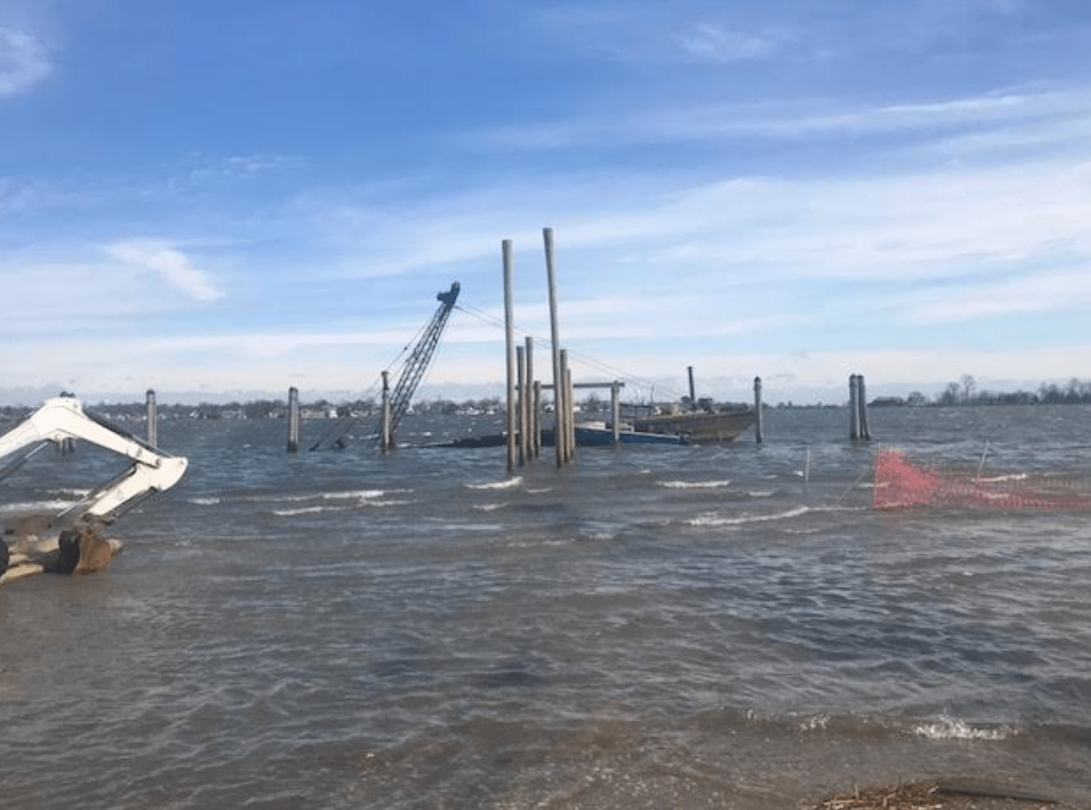 A barge that had a crane on it took on water overnight and at approximately 10:20 both crane and barge sunk. Contributed photo
