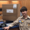 Andrew LaPadula wore his full Scout uniform to the Post Office when he shipped his packages to Puerto Rico.